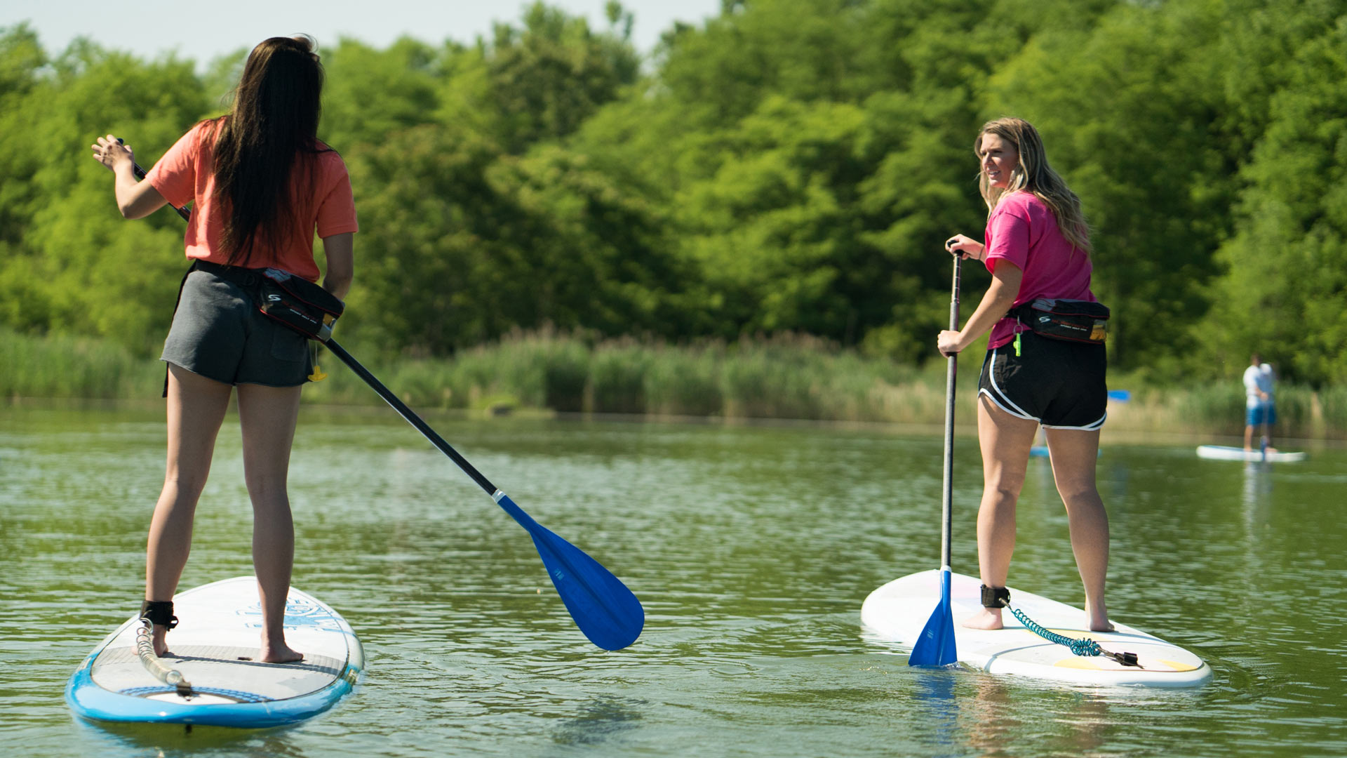 Paddle boarders on the quarry lake at Quarry Trails Metro Park.