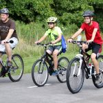 Father and sons biking on the Beech Woodland Trail at Rocky Fork.